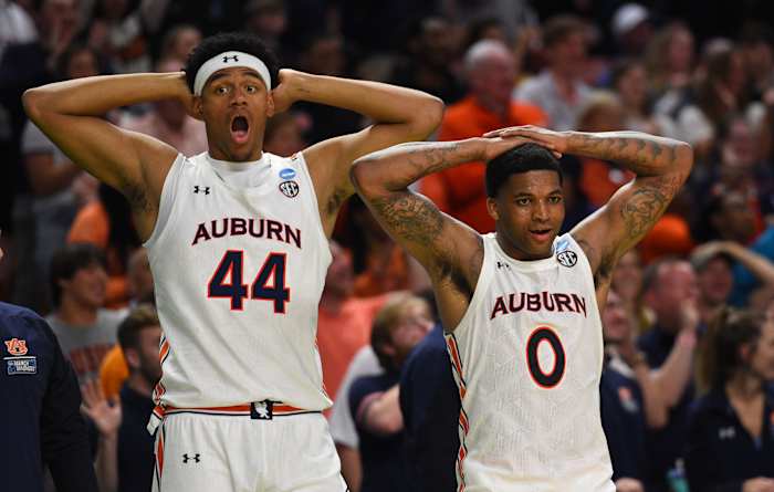 Mar 18, 2022; Greenville, SC, USA; Auburn Tigers center Dylan Cardwell (44) and Auburn Tigers guard K.D. Johnson (0) react against the Jackson State Tigers during the first round of the 2022 NCAA Tournament at Bon Secours Wellness Arena. Mandatory Credit: Bob Donnan-USA TODAY Sports